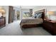 Comfortable bedroom featuring a large bed, balcony access, and abundant natural light at 2550 Harbourside Dr # 322, Longboat Key, FL 34228