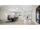 Bright dining room with modern lighting, a stylish table set, and a view to the outside at 2550 Harbourside Dr # 322, Longboat Key, FL 34228
