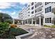 Striking apartment complex shows a stylish entrance, with a beautiful porte cochere at 2550 Harbourside Dr # 322, Longboat Key, FL 34228