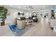 Spacious and open living room with stylish decor, a large sofa, and access to dining area at 2550 Harbourside Dr # 322, Longboat Key, FL 34228