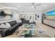 Large open living room with modern decor, a comfortable sofa, and a view of the dining area at 2550 Harbourside Dr # 322, Longboat Key, FL 34228