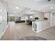 Spacious living and dining area with a modern aesthetic and access to an outdoor balcony at 2550 Harbourside Dr # 322, Longboat Key, FL 34228