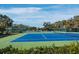 Bright blue tennis courts offer a scenic and active recreational option for residents and guests at 2550 Harbourside Dr # 322, Longboat Key, FL 34228