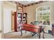 Home office with built-in desk and ample book shelving at 2773 Harvest Dr, Sarasota, FL 34240