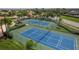 Two well-maintained tennis courts in a community at 2773 Harvest Dr, Sarasota, FL 34240