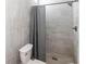 Bathroom with walk-in shower and gray tile at 2826 Marlette St, Sarasota, FL 34231