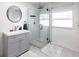 Modern bathroom with a walk-in shower and gray vanity at 2826 Marlette St, Sarasota, FL 34231