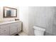 Clean bathroom, featuring white vanity and gray tile at 2826 Marlette St, Sarasota, FL 34231