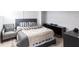 Cozy bedroom with a queen-size bed and gray accents at 2826 Marlette St, Sarasota, FL 34231