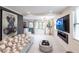 Bright living room with a modern fireplace and large TV at 2826 Marlette St, Sarasota, FL 34231
