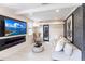 Living room with fireplace, large TV, and comfy couch at 2826 Marlette St, Sarasota, FL 34231
