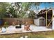 Outdoor patio with fire pit and storage shed at 2826 Marlette St, Sarasota, FL 34231