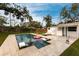 Inviting pool and spa with lounge chairs, surrounded by a spacious patio at 2826 Marlette St, Sarasota, FL 34231
