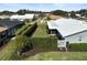 Aerial view showcasing the home's backyard and landscaping at 308 Matisse E Cir, Nokomis, FL 34275