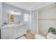 Updated bathroom with white vanity, walk-in shower, and tile floor at 308 Matisse E Cir, Nokomis, FL 34275