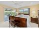Spacious bedroom with a king-size bed and sliding doors leading to the patio at 308 Matisse E Cir, Nokomis, FL 34275