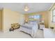 Guest bedroom with a queen-size bed and plenty of natural light at 308 Matisse E Cir, Nokomis, FL 34275