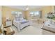 Cozy bedroom with a queen bed, nightstands, and ample closet space at 308 Matisse E Cir, Nokomis, FL 34275