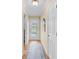 Light and airy entryway with wood floors and a mirror at 308 Matisse E Cir, Nokomis, FL 34275