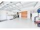Large garage with epoxy floor, workshop area, and laundry hookups at 308 Matisse E Cir, Nokomis, FL 34275