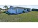 Newly renovated house exterior with gray siding and white trim at 308 Matisse E Cir, Nokomis, FL 34275