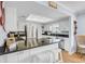 Modern kitchen with white cabinets, stainless steel appliances, and granite countertops at 308 Matisse E Cir, Nokomis, FL 34275