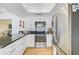 Updated kitchen featuring stainless steel appliances and dark countertops at 308 Matisse E Cir, Nokomis, FL 34275