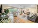 Spacious living room with hardwood floors and sliding glass doors at 308 Matisse E Cir, Nokomis, FL 34275