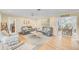 Open and bright living space with a view into dining area at 308 Matisse E Cir, Nokomis, FL 34275