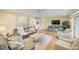 Comfortable living room with ample natural light and seating at 308 Matisse E Cir, Nokomis, FL 34275