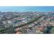Coastal community aerial view featuring waterfront homes, canals, and beaches in the background at 3131 Bayou Sound, Longboat Key, FL 34228