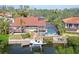 Aerial view of the home with boat dock, pool, and waterfront access on the canal at 3131 Bayou Sound, Longboat Key, FL 34228