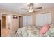 Cozy bedroom with a ceiling fan, ensuite bathroom, and two large closets at 3131 Bayou Sound, Longboat Key, FL 34228