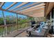Enjoy outdoor living on this deck with plush seating, overlooking a peaceful waterfront view at 3131 Bayou Sound, Longboat Key, FL 34228