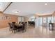 Bright dining room with neutral tile floors, large mirror, modern lighting, and ample space for entertaining at 3131 Bayou Sound, Longboat Key, FL 34228