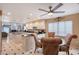 Bright kitchen with black and white floors, glass-top table, and views to the connected living space at 3131 Bayou Sound, Longboat Key, FL 34228