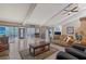Spacious living room featuring high ceilings, tiled floors, fireplace, comfortable seating and sliding glass doors at 3131 Bayou Sound, Longboat Key, FL 34228