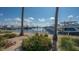 Picturesque marina view with various boats docked, framed by palm trees and colorful flowers at 3131 Bayou Sound, Longboat Key, FL 34228