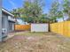 Backyard with a storage shed and wooden fence at 3419 27Th Pkwy, Sarasota, FL 34235