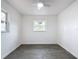 Bright bedroom with neutral walls and grey tile floors at 3419 27Th Pkwy, Sarasota, FL 34235