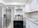 Modern kitchen with stainless steel appliances and white cabinetry at 3419 27Th Pkwy, Sarasota, FL 34235