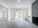 Spacious living room with tile floors and sliding glass doors to backyard at 3419 27Th Pkwy, Sarasota, FL 34235