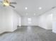 Bright living room with grey tile floors and ceiling fan at 3419 27Th Pkwy, Sarasota, FL 34235