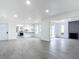 Open concept living room with kitchen and fireplace views at 3419 27Th Pkwy, Sarasota, FL 34235