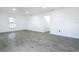 Bright living room with grey tile floors and ceiling fan at 3419 27Th Pkwy, Sarasota, FL 34235
