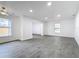 Bright living room with grey tile floors and ceiling fan at 3419 27Th Pkwy, Sarasota, FL 34235