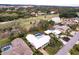 Aerial view of homes near a golf course and lake at 3746 Torrey Pines Blvd, Sarasota, FL 34238