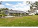 Expansive backyard featuring a large screened pool at 3746 Torrey Pines Blvd, Sarasota, FL 34238
