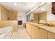 Elegant bathroom with double vanity, granite countertops, and a soaking tub at 3746 Torrey Pines Blvd, Sarasota, FL 34238