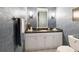 Clean bathroom with white vanity, granite countertop, and blue tile walls at 3746 Torrey Pines Blvd, Sarasota, FL 34238